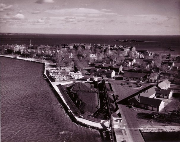 <p>Aerial view of the Quartermaster Area (foreground) and adjoining sections of Fort Slocum, looking northeast, November 1961.</p>