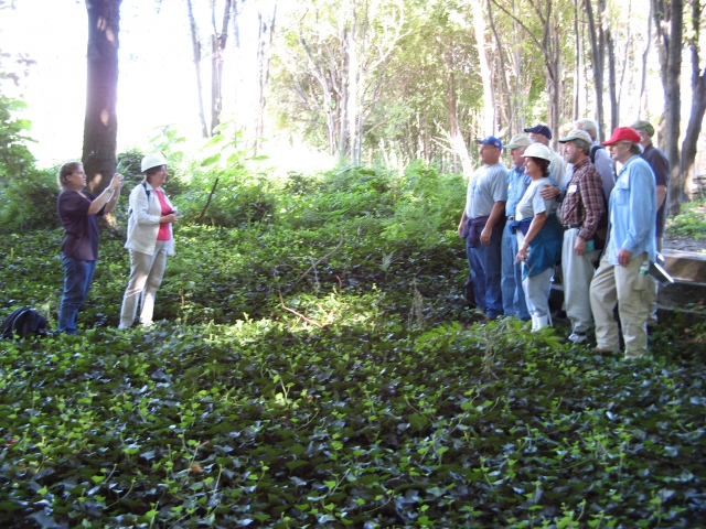 <p>Group tour of Davids Island posing near the Commanding Officer&#39;s Quarters (Building 1), September 2007. At left are Nancy Brighton (with camera) and Barbara Davis. The group includes: Harold Crocker, George Willhite, Susan Edwards, Bill Carlson, and Pat Skelly (left-right, front); John Pardon, Joel Simons, and Bill Waterhouse (left-right, back)</p>