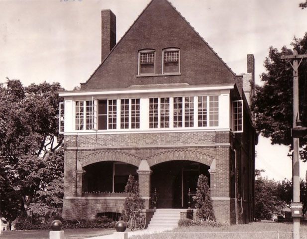 <p><strong>Romanesque Revival</strong>: Commanding Officer&#39;s Quarters (Building 1), east facade with enclosed second-floor sun porch (added about 1938), view west, ca. 1939.</p>