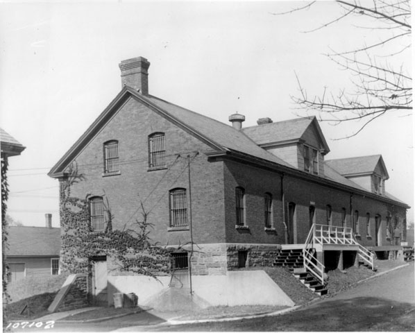 <p><strong>Colonial Revival</strong>: Early example of the style. Quartermaster Storehouse/Commissary (Building 16), built 1904, shown in view to northwest, ca. 1935.</p>