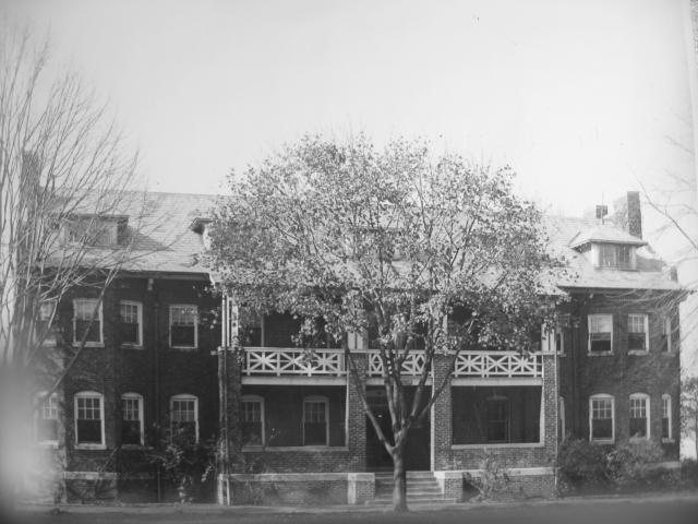 <p><strong>Craftsman-influenced Colonial Revival</strong>: Officers&#39; Quarters (Building 12; built 1910), east facade with prominent porch, view west, ca. 1935.</p>