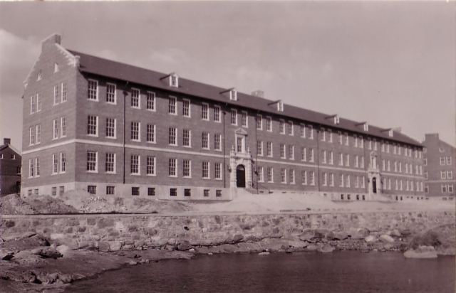 <p><strong>Colonial Revival</strong>: A later example of the style, now greatly simplified. Barracks (Building 59), built 1939, showing the east facade in a view to west-northwest, ca. 1940.</p>