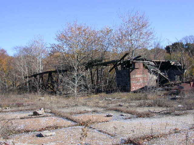 <p>View southeast of the Coal Yard interior, taken in November 2005. This structure was demolished in November 2006 and the perimeter wall was removed in 2008.</p>