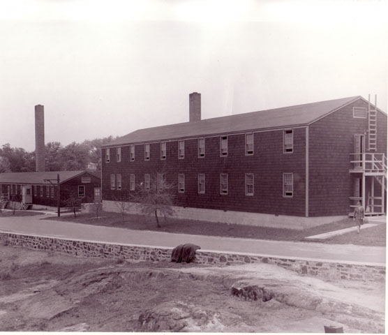 <p><strong>Army Standardized Expedient, 700-series, wood construction</strong>: WAC Barracks and WAC Recreation &amp; Administration Building (Buildings 131-130, left-right; built 1943), view north, ca. 1943.</p>