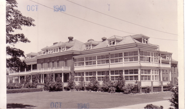 <p>Quartermaster Corps photograph of the south and east facades of the Hospital (Building 46) looking northwest, taken in 1940.</p>