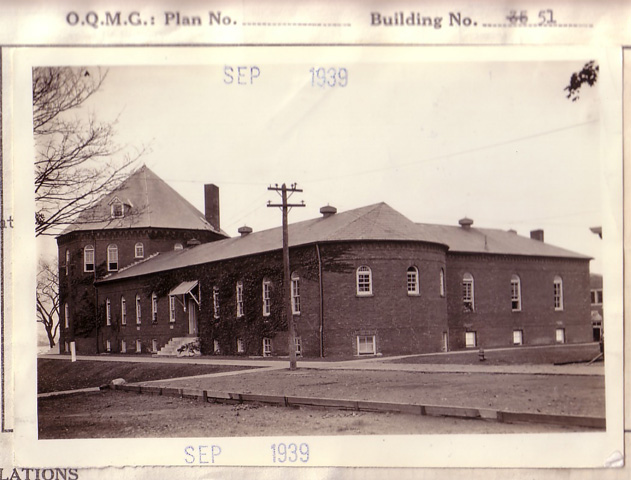 <p>Quartermaster Corps photograph of the west facade and adjoining sections of the 1888 Barracks (Building 55) looking north, taken in 1939.</p>