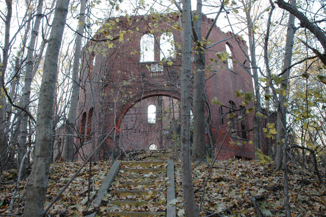 <p>View southeast of the ruins of the center tower of Building 55 with its arched entryway, taken in December 2005. The building was demolished in May 2008.</p>