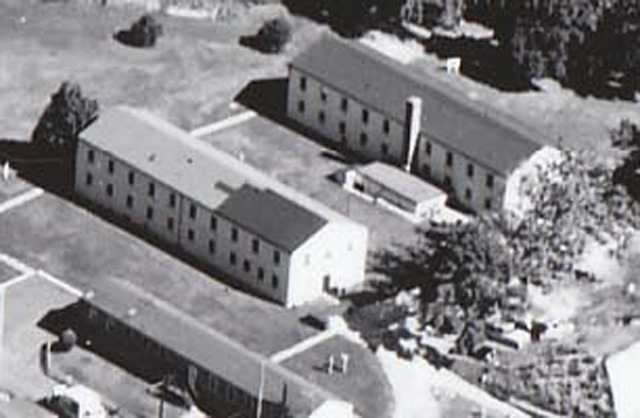 <p>Detail of an aerial photograph of Davids Island taken in the late 1950s showing the two WAC Barracks built in 1944. Building 134 is at left and Building 135 is at right.</p>