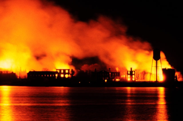 <p>The &#34;Great Fire&#34; of April 21, 1982, destroyed at least 15 buildings of former Fort Slocum in the northeastern section of Davids Island (Photo by Peter Krupenye, originally published in The New York Times on April 23, 1982).</p>