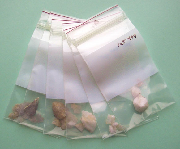 <p>Chips of quartz and chert produced as Native Americans made stone tools during the prehistoric period. Shown are artifacts from Davids Island after cleaning and identification in the laboratory, with each type of artifact placed in a separate plastic bag.</p>