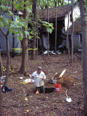 <p>Excavation of a 1-meter (3.3-foot) square test unit, which provides detailed information about artifacts at different depths in the soil, near Building 3, October 2006.</p>