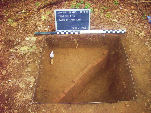 <p>Line of nearly-upright bricks discovered buried beneath 7 inches of soil during excavation of an archeological test unit near one of the officers&#39; quarters (Building 6), October 2006. The line of bricks marked the former edge of a sidewalk constructed in the 1880s that was later partially demolished by removal of the surface brickwork.</p>