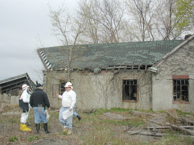 <p>Members of a Corps of Engineers reconnaissance team standing by the Passenger Waiting Room / Quarters (Building 30), view to northwest, April 2004.</p>