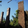 <p><strong>Queen Anne, detail</strong>: Brick chimneys with decorative terra cotta plaque (center of right chimney). Ruins of Officers&#39; Quarters (Building 5), view southwest, October 2006.</p>