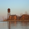 <p>Western shoreline of the Hospital Area, looking east, November 2004. Left to right are the Water Tower (Building 45), NCO Quarters (Building 44) and Hospital Sergeants&#39; Quarters (Building 43).</p>