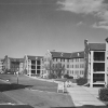 <p>Three barracks built in the 1930s (Buildings 58-60) dominated the eastern side of the Barracks Area, shown here looking north in the mid-1950s.</p>