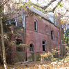 <p>View west of the north and part of the east facade of the Commanding Officer&#39;s Quarters (Building 1), taken in November 2004. This building was demolished in August 2008.</p>