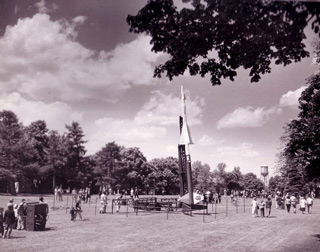 Armed Forces Day at Fort Slocum 1961. At the center of the photo is a Nike Ajax antiaircraft missile, like those of Fort Slocum’s missile battery, in a mobile launching cradle.