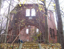 View southeast of the ruins of the center tower of Building 55 with its arched entryway, taken in December 2005. The building was demolished in May 2008.