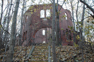 Ruins of the octagonal center tower and main entrance of Building 55 (Barracks).